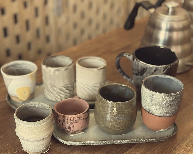 Handmade coffee cups arranged with quiet intention